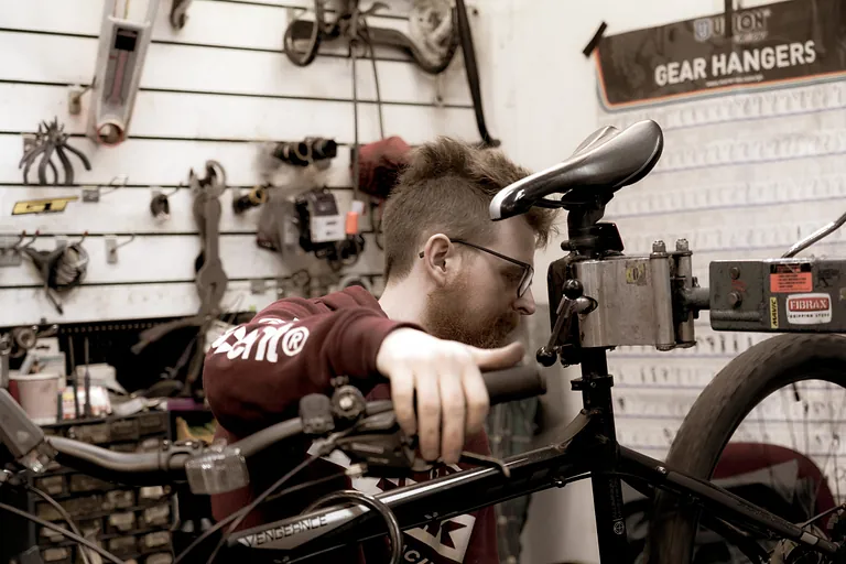 Hollingsworth Cycles mechanic servicing a bike on the workstand in our Templeogue workshop
